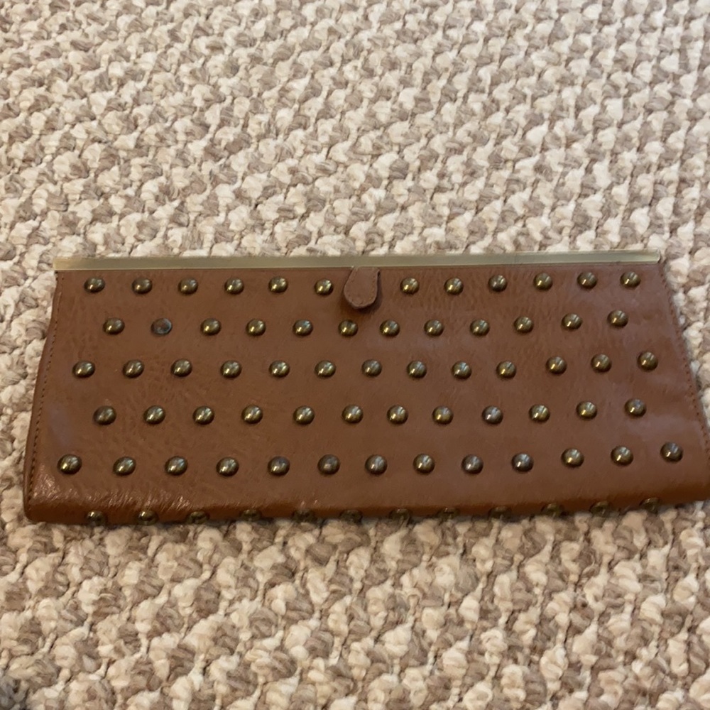 Tan studded clutch